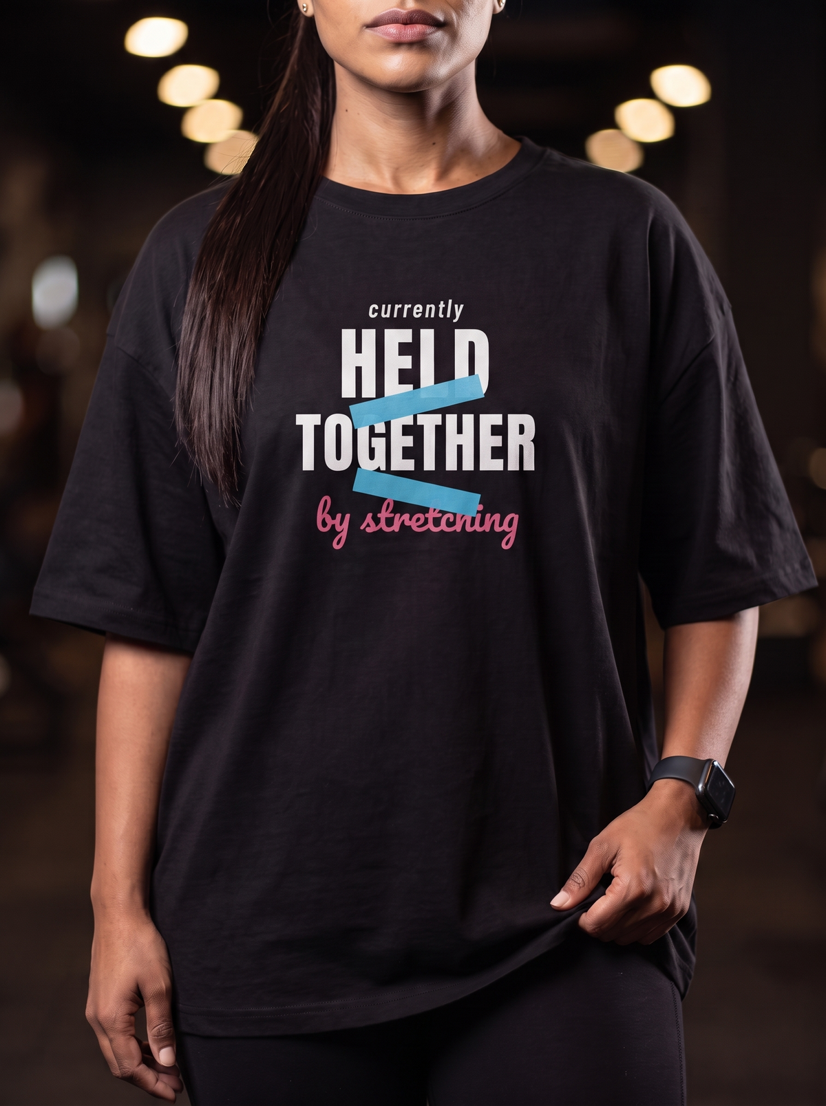 Held By Stretching box fit gym t shirt for women in Black, close up of the front graphic print