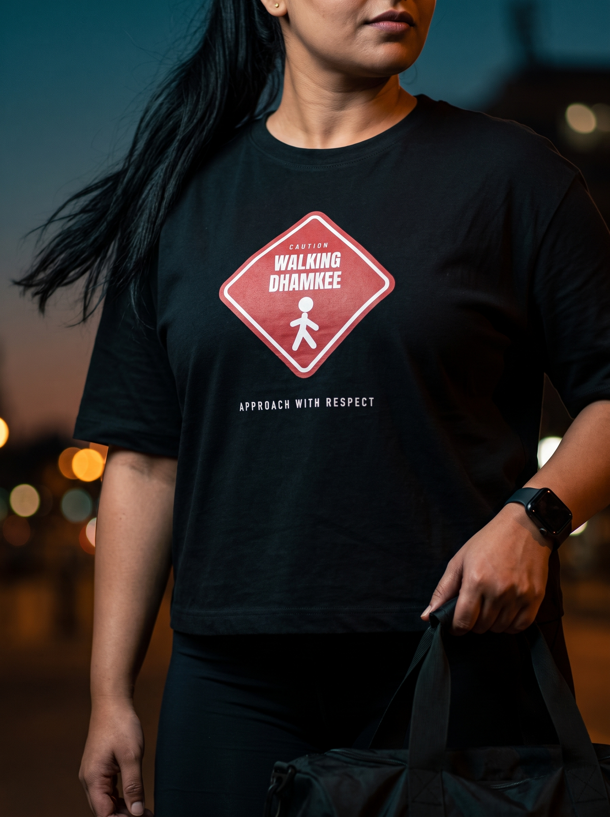 Walking Dhamkee box fit gym t shirt for women in Black, close up of the front graphic print