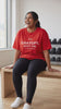 ChatGPT, Spot Me tee in red, worn on a gym bench